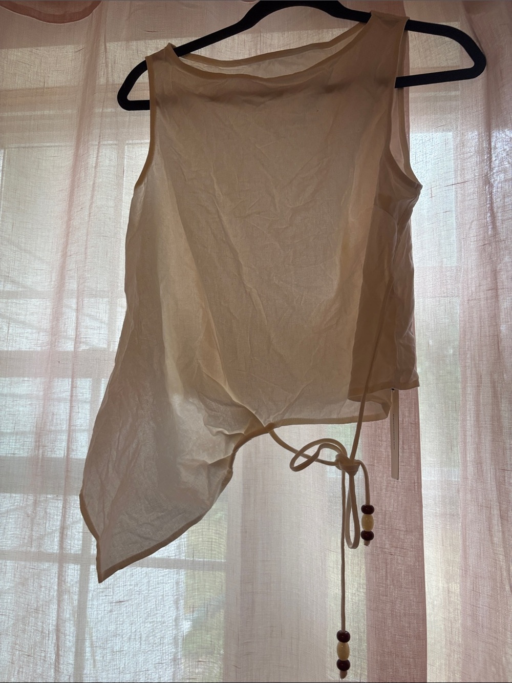 11. Commense Cream Asymmetric Tie-Waist Camisole
